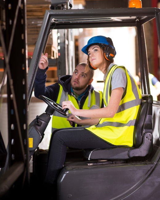 Forklift operator being inducted on site in a warehouse